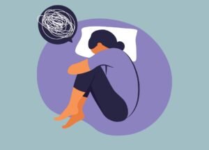 Illustration of a person curled up on a pillow with a scribbled thought bubble above their head
